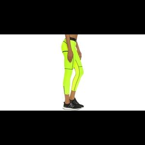 Medium Monreal tights. Neon yellow with black
